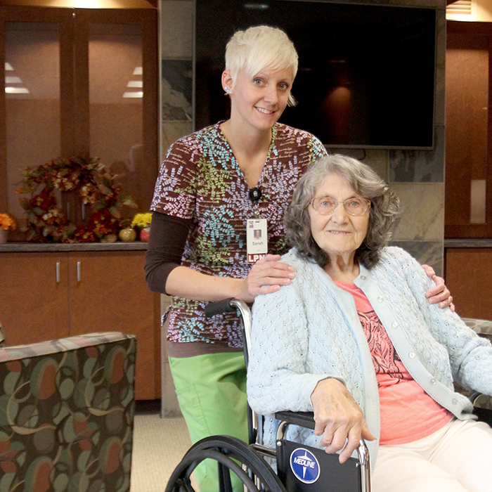 Beaver Dam Community Hospital senior living facility nurse with a patient in a wheelchair