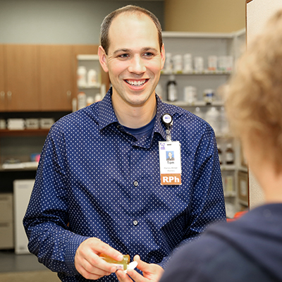 Beaver Dam Community Hospital pharmacy; pharmacist helping a patient