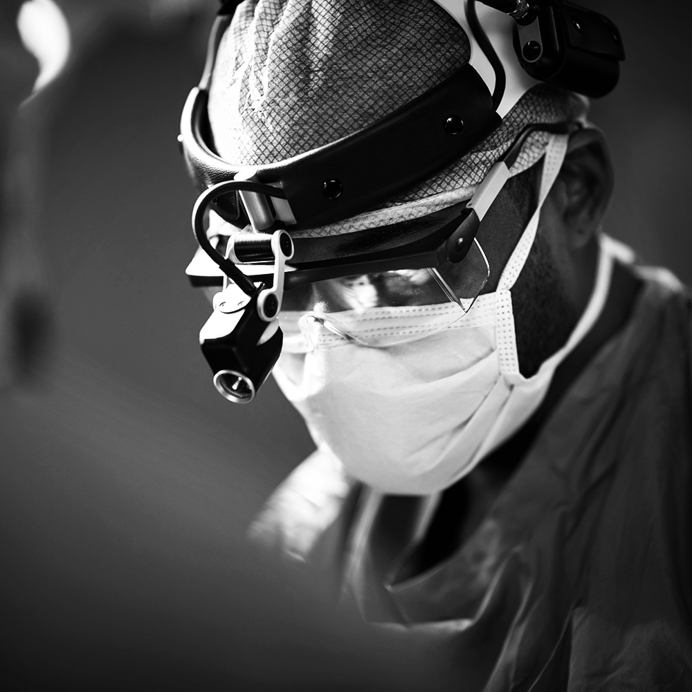 Closeup of doctor's masked face, performing surgery; Beaver Dam Community Hospital surgical services